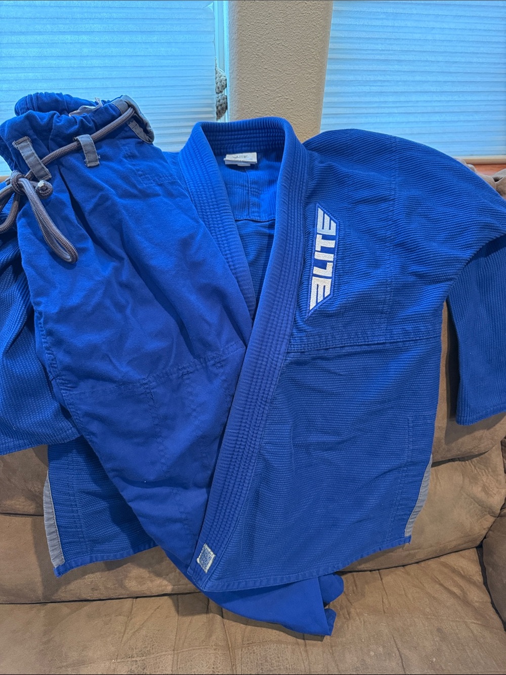 Woman’s Blue Martial Arts Gi Jacket and Pant Set from Elite.
